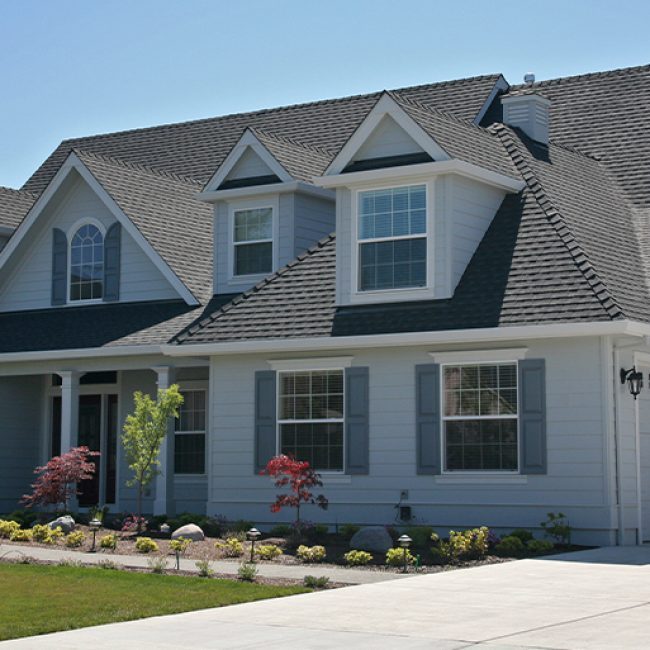 Edwardsville Illinois area home with a new architectural shingle roof after hail damage replacement